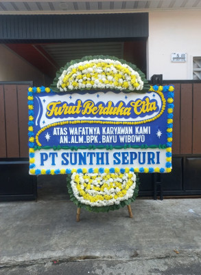 Papan Bunga Duka di Darat